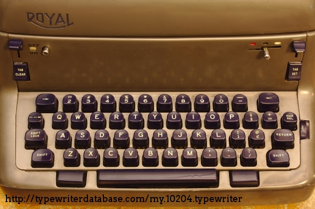 At the right is a strike force dial, allowing one to determine how hard the typebars strike the platen. Can be dialed up for making tons of carbon copies at once or dialed back for quieter single-sheet typing. There is an audible difference between the three settings.