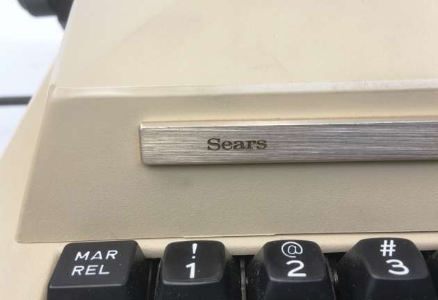Sears "The Scholar with correction" from the logo on the left side...