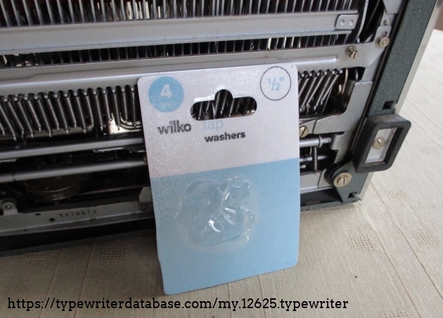 I just happened to have a couple of packets of tap washers (I must fix that dripping tap!) and the 1/2 inch washers have solved the carriage catching the frame issue.  These washers are probably a fraction too thick, but they are close enough to do the job