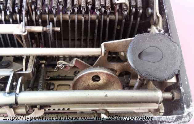 The missing bell mechanism - all that remains is the bell itself and a broken spring.