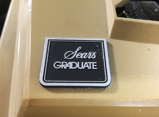 Sears "Graduate" badge on ribbon cover...