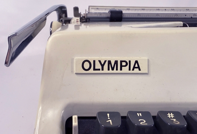 Olympia "SM9" from the maker logo on the front (detail)...