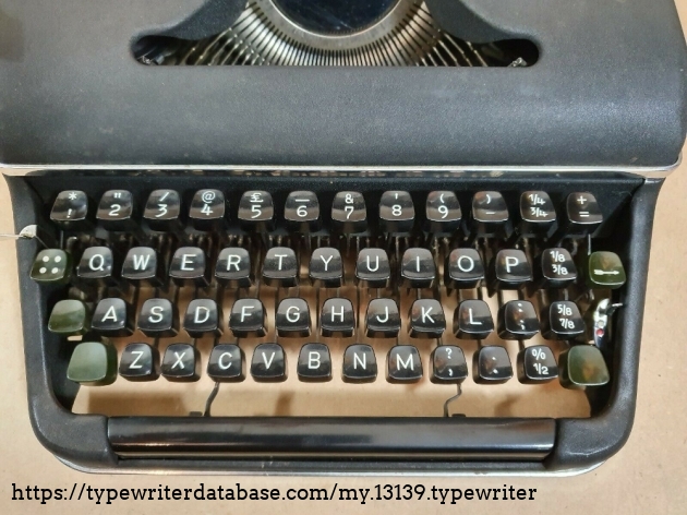 The black English keyboard with dark green function keys