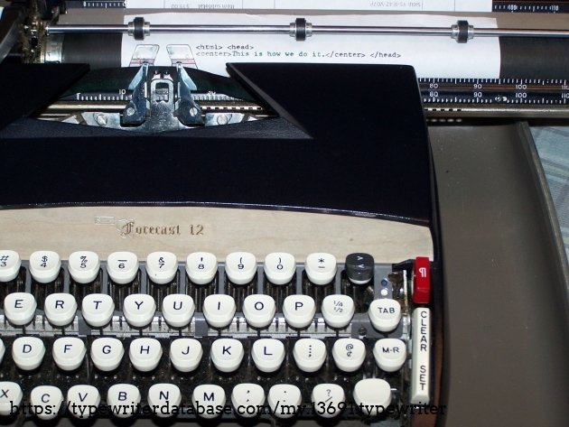 Designing a webpage on my typewriter and showing off the greater-than/less-than Change-A-Type.
