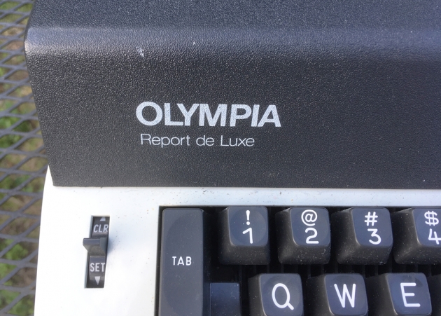 Olympia "Report deLuxe" from the logo/model on the left front...