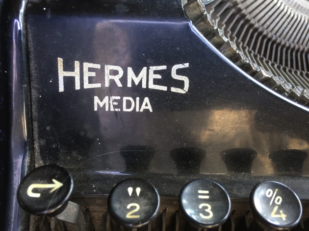 Hermes "Media"  from the maker and model logo on the left side...