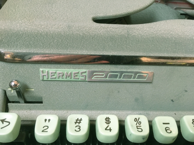 Hermes "2000" maker and model logo badge on  the front...