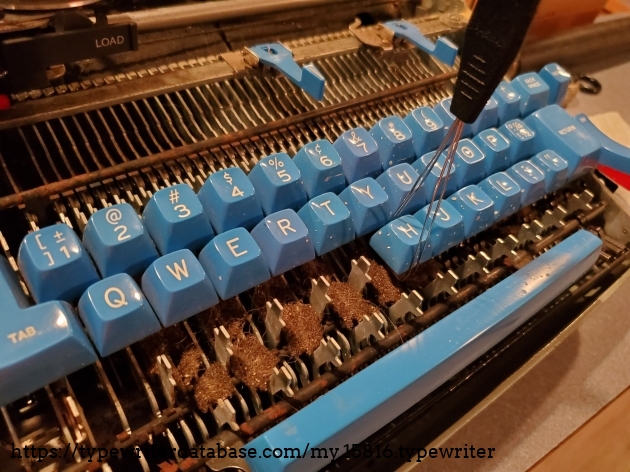 Pulling keys from the donor machine. They needed some cleaning as they were spritzed with white paint at some point.