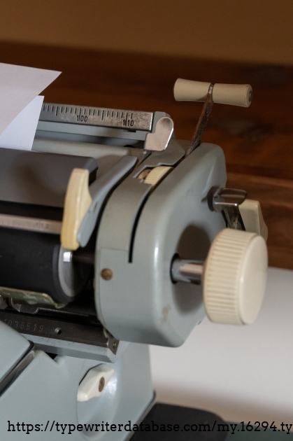 The SG-1's paper injector. Pull handle to shoot paper forward at speed.
