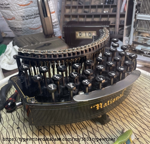 The typebar/keyboard unit comes out with the removal of three screws and some jiggling.