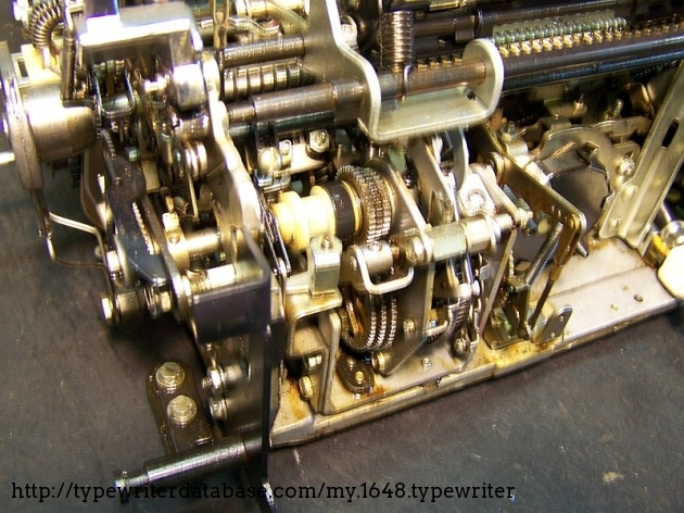 The three sets of incremental-size gears allow the three different escapement pitches. A gear changer engages only one set at a time.