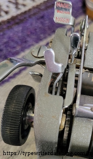 Left carriage close-up - line spacing lever and Magic Margin lever.