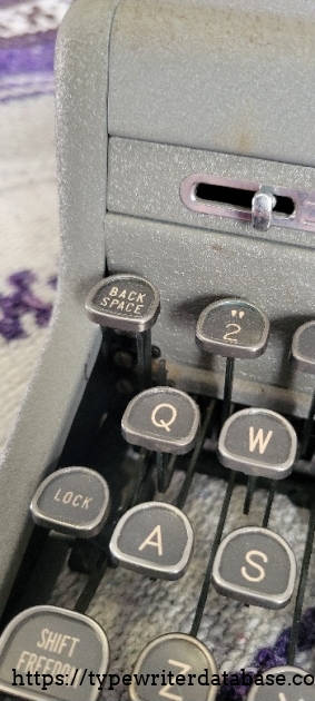 Left keys close-up, ribbon reverse lever, back space, shift lock, "shift freedom."