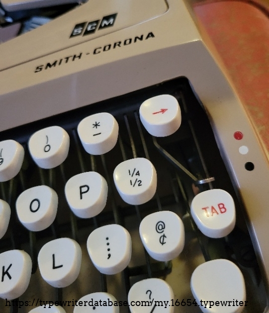 Close-up of right keys, logo and ribbon selector.