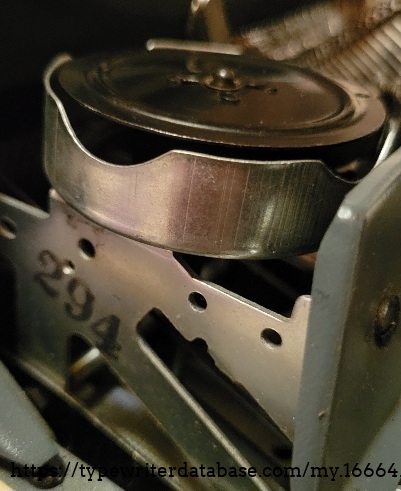 Side view of frame under right ribbon spool - marked 294.