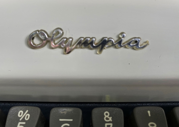 Olympia "SM9" from the maker logo above the keyboard....