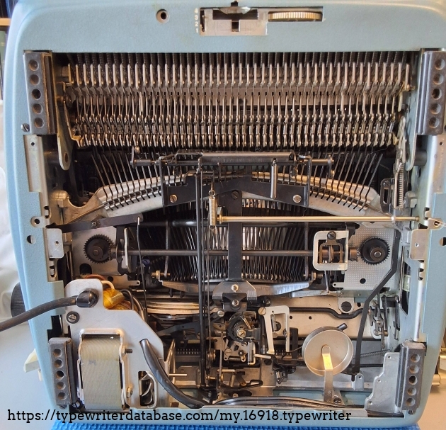 The ribbon feed gears are still metallic in 1964.