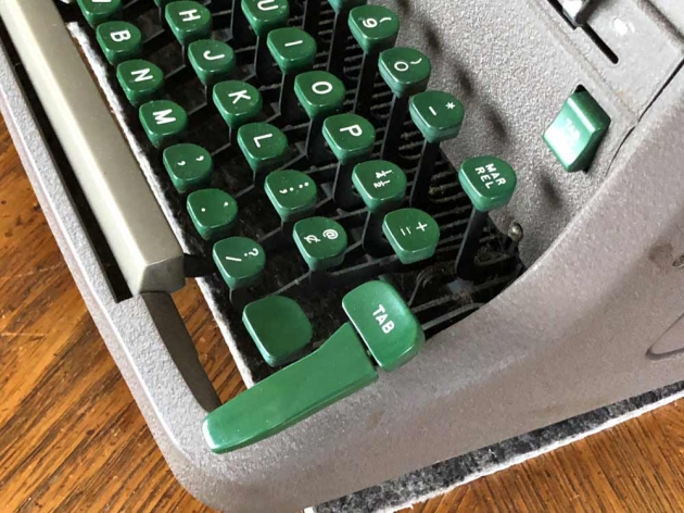 The iconic Tab key of the Royal HH. The smaller key marked "TAB" can be triggered with the pinkie as usual; the giant palm tab key can be hit when you're excited or in a hurry; it then pushes the smaller key down to effect the Tab action.