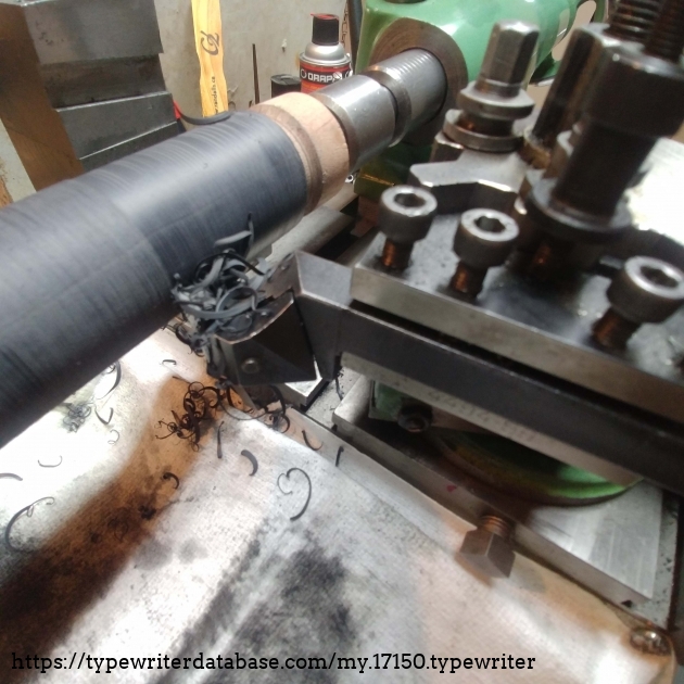 Two layers of heat shrink tubing mounted. Platen is now too big at 33.4 mm. First pass shaving off the excess heat shrink.