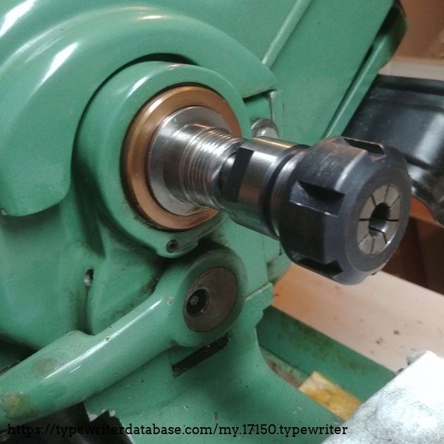 A 10 mm ER25 collet works much better than a three-jaw chuck to grip the small end of the platen core (right hand side as installed).