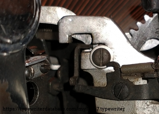 Same spot on the A typebar. The tooth is worn away. You can also see the missing plating on the return lever in this photo.