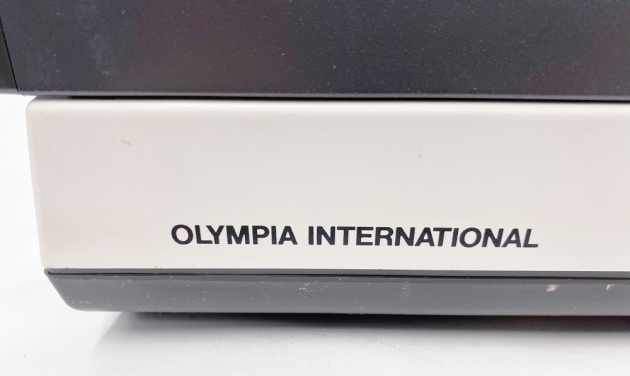 Olympia "Report Electric" from the logo on the back...