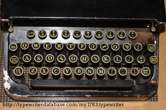 This typewriter has several "special" key tops that add to its charm and character