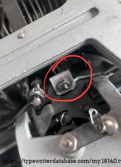 A sheared off adjustment screw (one of two on the machine) and the metal "square" adds depth and width to the trigger point.