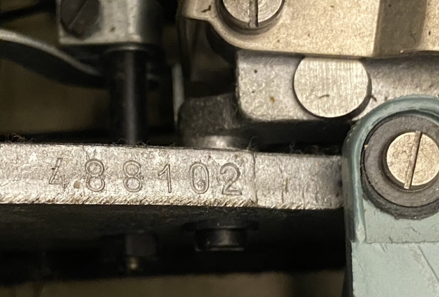 Serial number. Underneath the carriage on the right hand side.