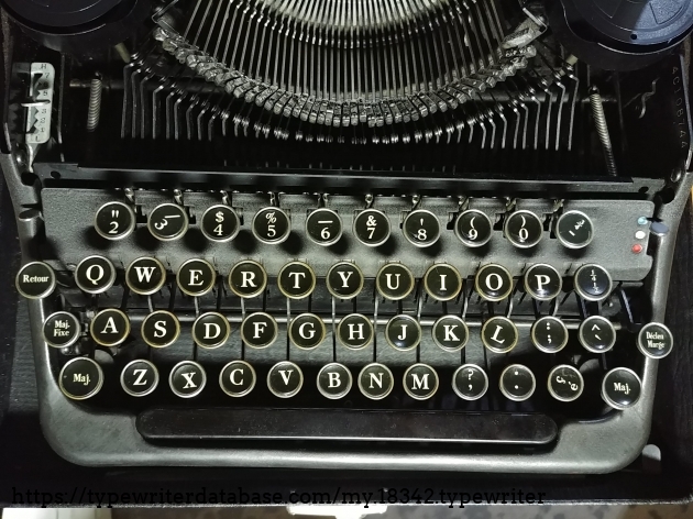 French diacritic signs on QWERTY keyboard and, keytops with functions in French:  Majuscule (Maj.), Maj. Fixe, Retour and Déclanche (Déclan) Marge. After I took the photo, I rotated the legends to the correct position.