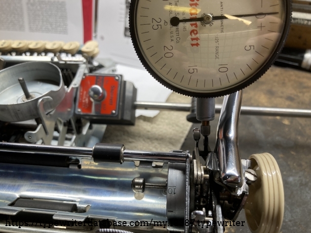 Close up on the indicator tip. By adjusting the bearing rails carefully, one screw at a time, I was able to get the carriage much tighter with no binding. 15 to 20 thousandths is where I ended up.