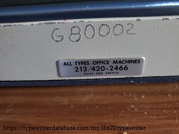 This machine's seen some hard use, all sorts of chips in the case and this engraving on the front. Maybe I should paint it...