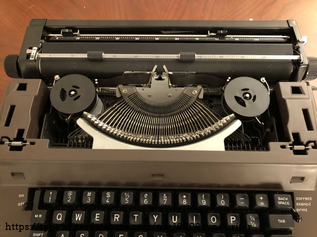 View of type bars with front cover removed. This typewriter cover lifts off with a smooth upwards motion. One of the best removable covers I've seen yet on a typewriter.