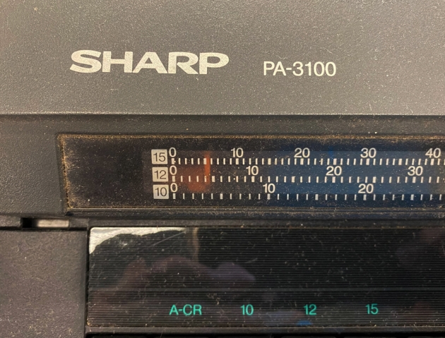 Sharp "PA-3100" from the maker/model logo on the top...