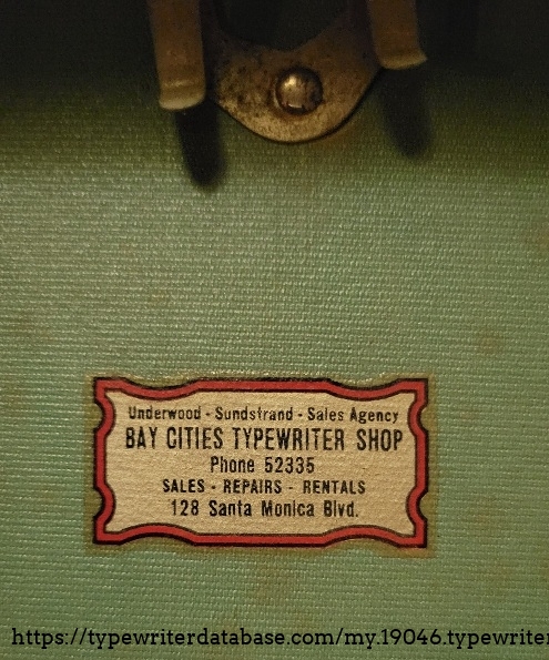 Inside case lid has a local typewriter shop label.