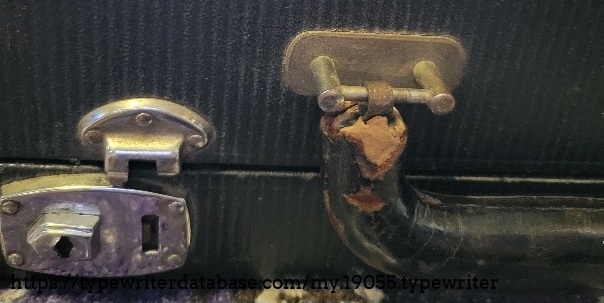 Case detail - left lock missing a piece and handle deterioration.