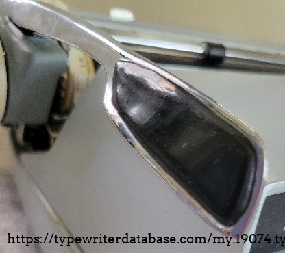 Carriage return handle close-up.