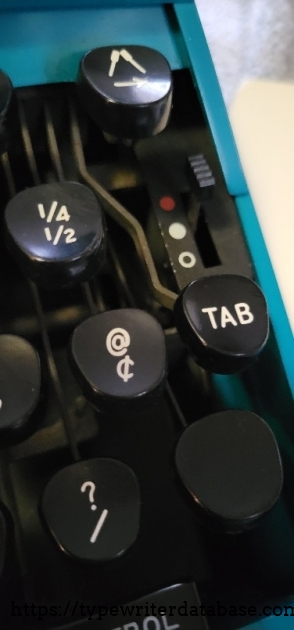Close-up of right keys, backspace/dejammer, ribbon selector.
