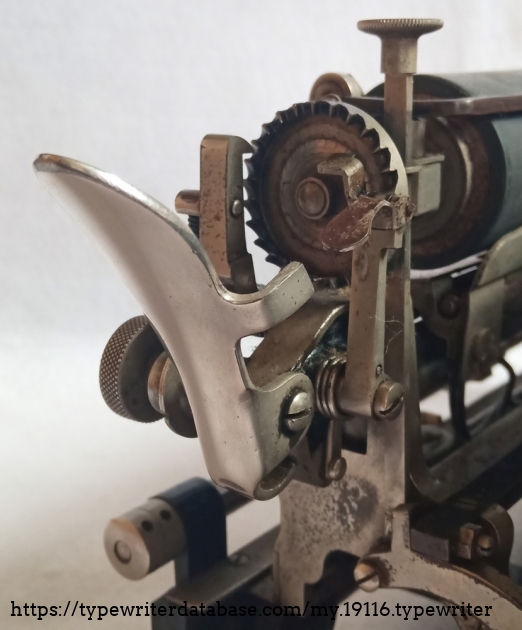 This is the carriage return mechanism with line shift lever and gear wheel on the paper carriage