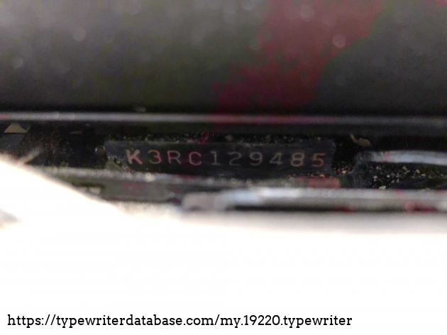 View of typewriter serial number. This is near/under platten on right side of typewriter.