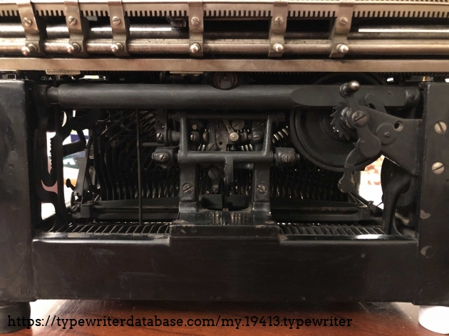Typewriter back view. Most parts needed liberal mineral spirits to start functioning normally.