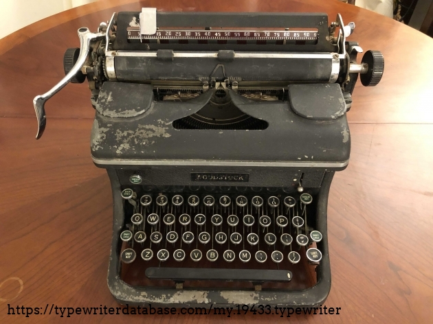 Front view of typewriter. Note badly flaking paint (especially the area near the space bar.) Also note the poor quality of decal. I suspect wartime shortages to have lead to the poor aesthetic detailing.