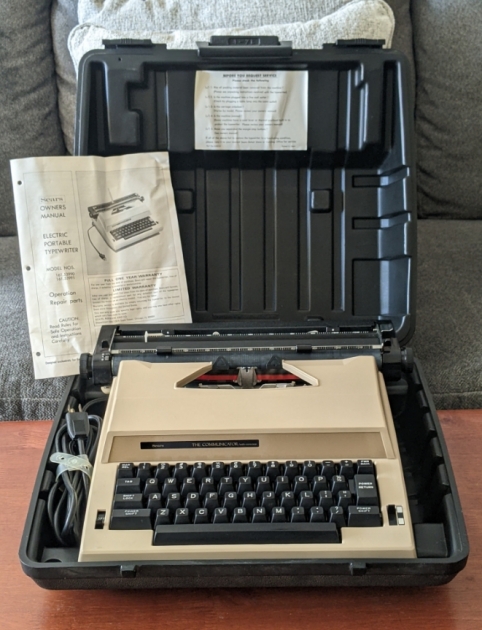 Typewriter in case with manual