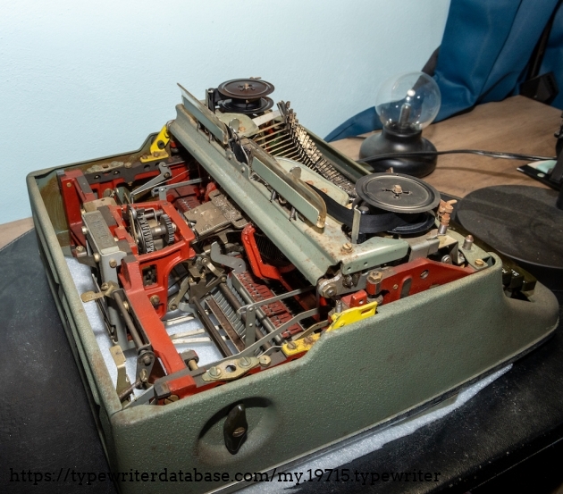 Back left of the typewriter with the carriage and ribbon cover removed.