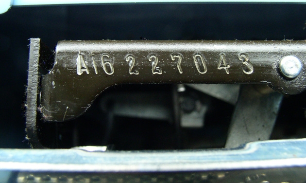 Here's a pic of the serial number; good luck discerning that second character. A close-up is in the next pic. You could make a case that the first three characters are a different typestyle from the last six and thus are a separately stamped prefix, except that the 6 and the 0 look like the same style....