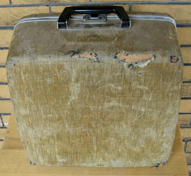 It’s a tribute to the solidity of the case that the outside looks like this, but the typewriter inside still works. Through all its adventures, previous owners preserved the key to this case, which is still inside it.