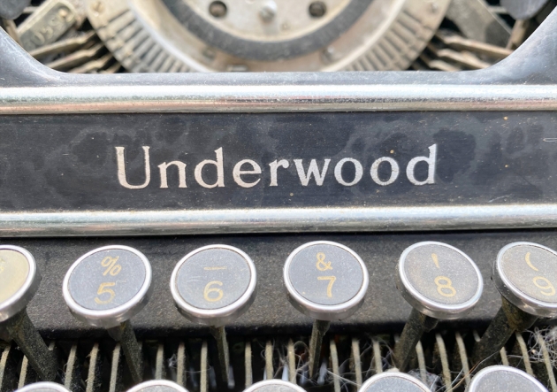 Underwood "Champion" from the maker logo above the keyboard...