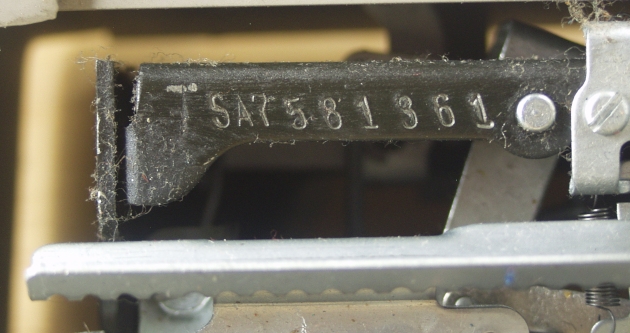 Move the carriage all the way to the right to find the serial number.