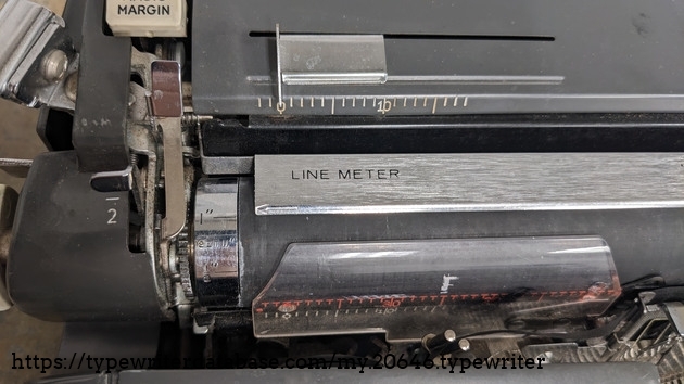 One of Royal's "extra" features; the line meter. It's used to track how close you are to the bottom of the sheet so you can maintain even bottom margins more easily.