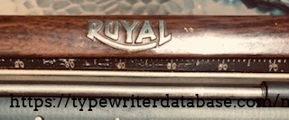 A close-up shows the detail and realism of the fake wood paint job on the 1929 Royal Model P.